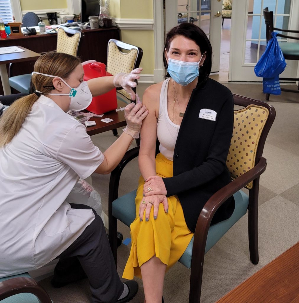 Woman Smiling Receiving Covid-19 Vaccine