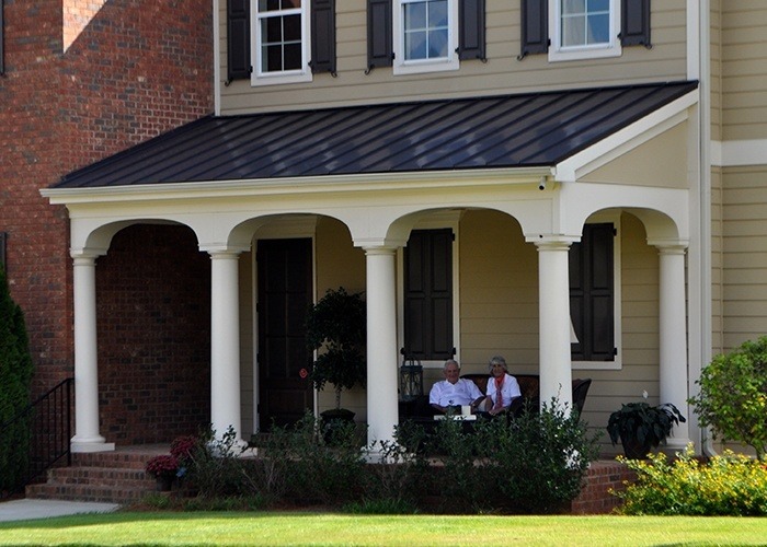 Couple Sitting on the Porch of their Home at Sterling Estates