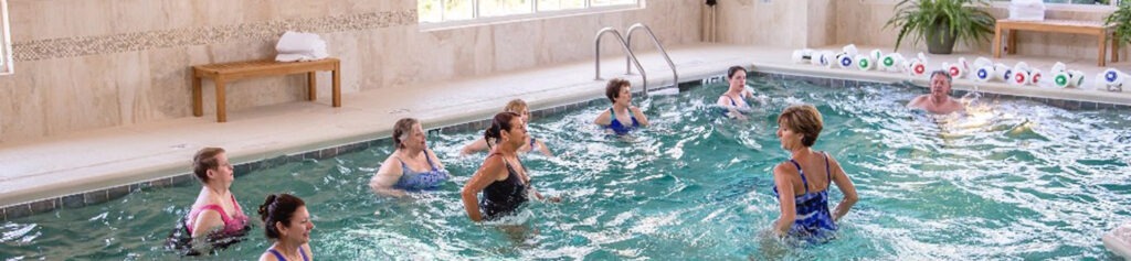 Senior Doing Water Aerobics in Pool