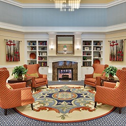 Interior View of Clubhouse Seating Area with Fireplace at Sterling Estates