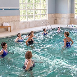 Senior Residents Doing Pool Aerobics at Sterling Estates