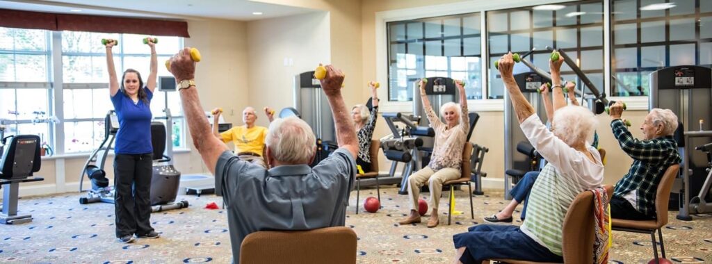 Seniors Doing Seated Chair Aerobics at Sterling Estates